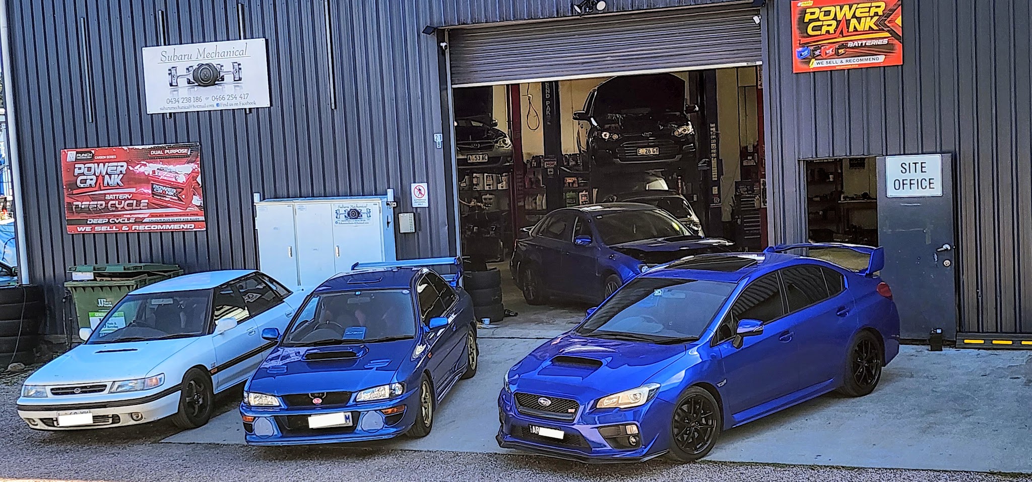 Three Subarus lined up outside the Subaru Mechanical workshop in Latrobe