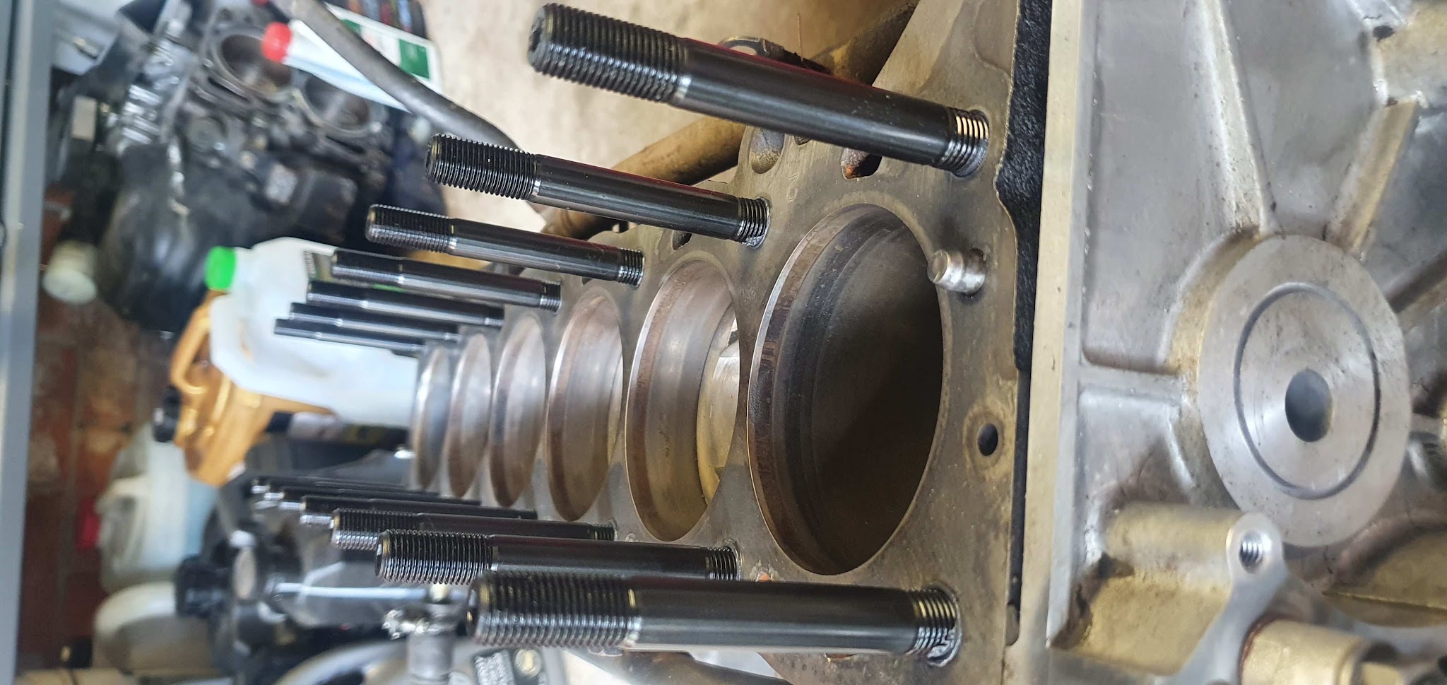 A bare Subaru short block with head studs fitted
